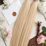 Tincsezett enyhén hamvas platina szőke 70-75cm 100% eredeti emberi haj/ 10gr